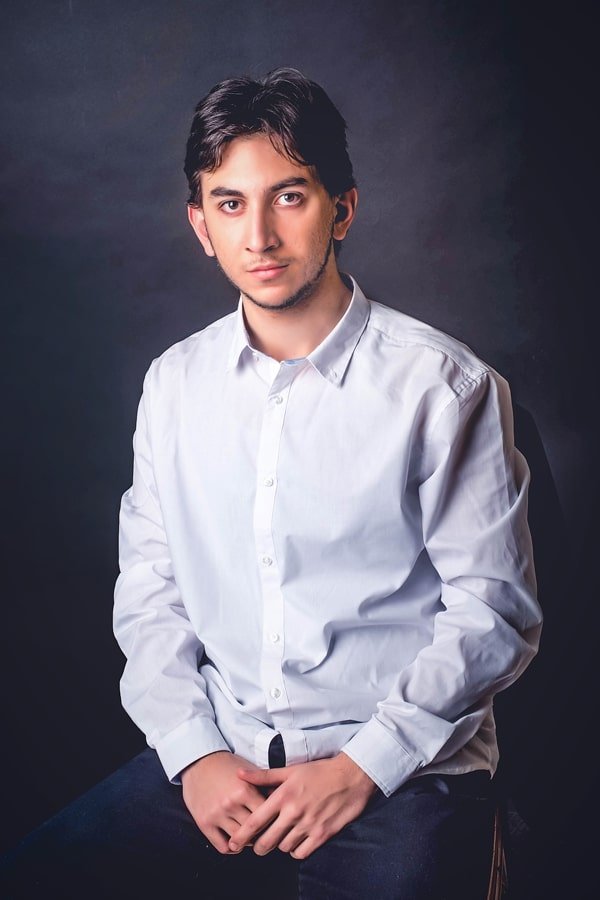 Portrait of Gagi Sikharulashvili in a white shirt
